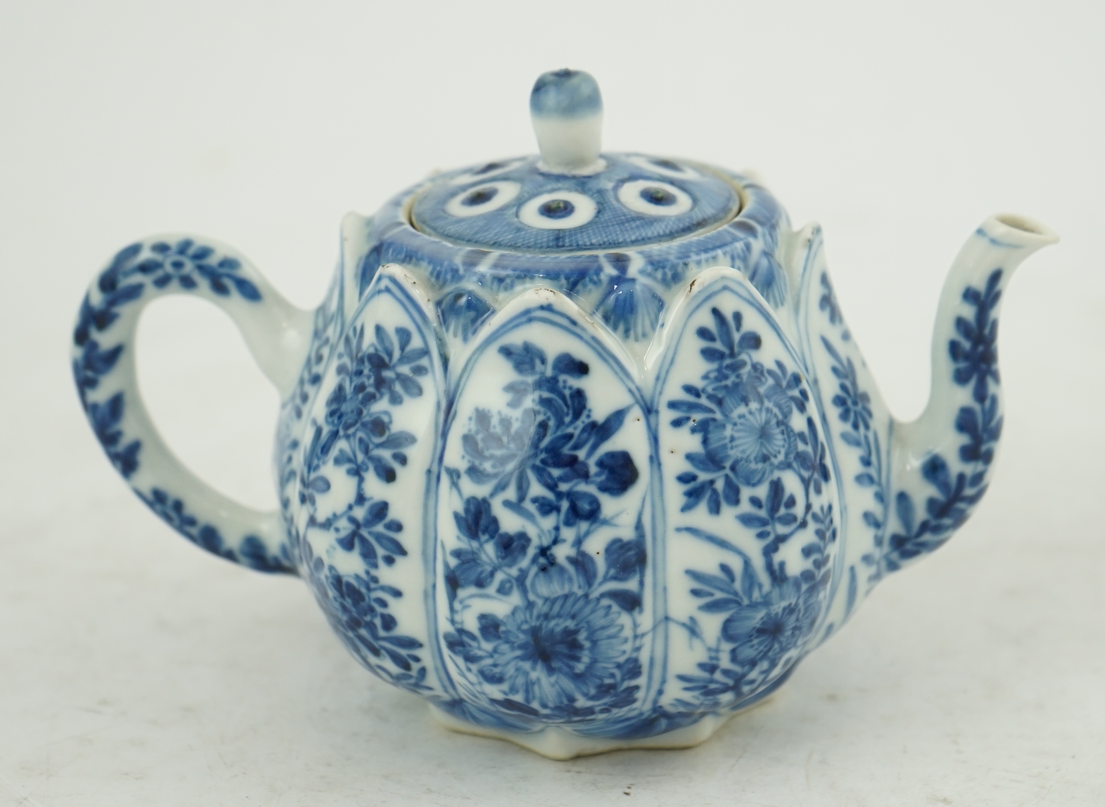 A Chinese blue and white lotus pod-shaped teapot and cover, Kangxi period